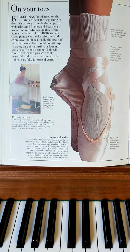 Anna-Christina's ballet feet photographed in a Ballet book with Dame Darcey Bussell