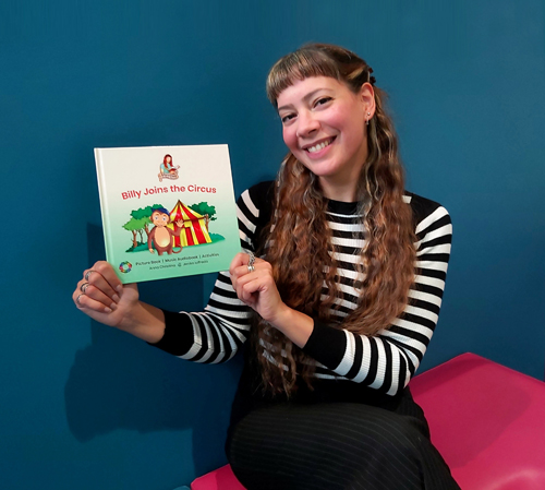 Anna-Christina with her First Edition children's picture book, Billy Joins the Circus